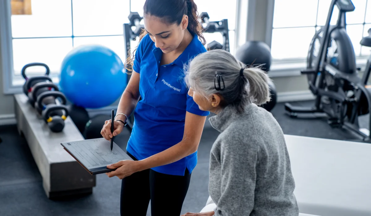 Occupational therapist carrying out a functional assessment with an adult patient
