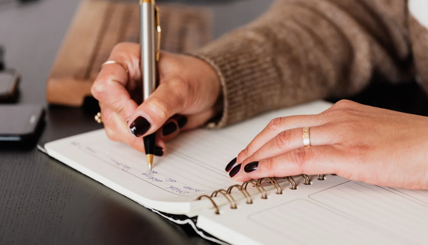 Occupational therapist recording written observations during a handwriting assessment