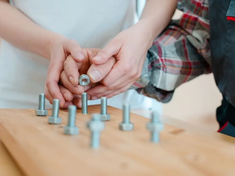 Adult practising an everyday task with an occupational therapist's support