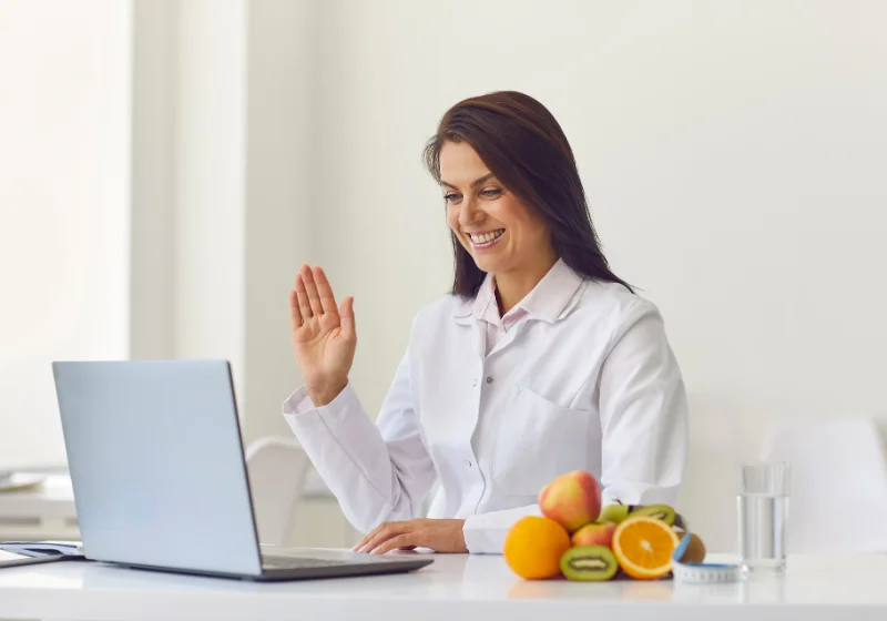 Physiotherapist conducting an online physiotherapy consultation over a video call from the TheraCure clinic in South Mumbai